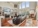 Spacious living room with a fireplace and hardwood floors at 9502 Hempel Cove Blvd, Windermere, FL 34786