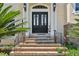 Brick stairs leading to a double front door at 9502 Hempel Cove Blvd, Windermere, FL 34786