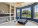 Private home gym with a treadmill and built-in shelving at 9502 Hempel Cove Blvd, Windermere, FL 34786
