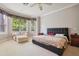 Large bedroom with a king-size bed and plenty of natural light at 9502 Hempel Cove Blvd, Windermere, FL 34786