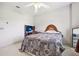 Bedroom with a queen-size bed, desk, and mirror at 9502 Hempel Cove Blvd, Windermere, FL 34786