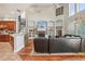 Open living room with a fireplace, built-in shelving, and hardwood floors at 9502 Hempel Cove Blvd, Windermere, FL 34786
