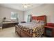 Cozy bedroom with a queen-size bed and large window at 9502 Hempel Cove Blvd, Windermere, FL 34786