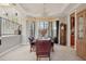 Spacious dining room with large windows and chandelier at 9502 Hempel Cove Blvd, Windermere, FL 34786