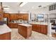 Spacious kitchen with wood cabinets, island, and granite countertops at 9502 Hempel Cove Blvd, Windermere, FL 34786