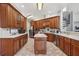 Well-equipped kitchen with wood cabinets, an island, and ample counter space at 9502 Hempel Cove Blvd, Windermere, FL 34786
