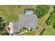 Aerial view of house, pool, and surrounding landscape at 9502 Hempel Cove Blvd, Windermere, FL 34786