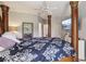 Main bedroom with a large bed and TV at 9502 Hempel Cove Blvd, Windermere, FL 34786