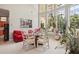 Bright breakfast nook with a glass table and comfortable seating near large windows at 9502 Hempel Cove Blvd, Windermere, FL 34786