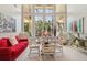 Breakfast nook with a glass-top table and seating area near large windows at 9502 Hempel Cove Blvd, Windermere, FL 34786