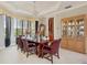 Bright dining room featuring a wooden table and hardwood floors at 9502 Hempel Cove Blvd, Windermere, FL 34786