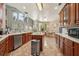 Open kitchen with an island, wood cabinets, and granite countertops at 9502 Hempel Cove Blvd, Windermere, FL 34786