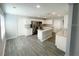 Modern kitchen with island, stainless steel appliances, and granite countertops at 705 Harland Ct, Kissimmee, FL 34758