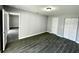 Spacious bedroom with ample closet space and wood-look flooring at 705 Harland Ct, Kissimmee, FL 34758