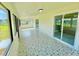 Spacious Florida Room with patterned tile floor and screened windows at 705 Harland Ct, Kissimmee, FL 34758