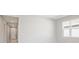 Bright living room with neutral walls and hallway access at 2216 Mac Blvd, Eagle Lake, FL 33839