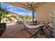 Relaxing backyard with patio, hammock, and seating area at 2518 Fontaine Dr, Kissimmee, FL 34741