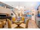 Open kitchen with an island, stainless steel appliances, and view of dining area at 2518 Fontaine Dr, Kissimmee, FL 34741