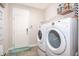 Convenient laundry room with washer, dryer, and extra storage at 2518 Fontaine Dr, Kissimmee, FL 34741