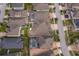 Aerial view of houses with pools and lush landscaping in a residential neighborhood at 2518 Fontaine Dr, Kissimmee, FL 34741