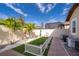 Small, fenced backyard with artificial turf and AC units at 2518 Fontaine Dr, Kissimmee, FL 34741
