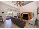 Spacious living room with leather sofa and access to backyard at 2518 Fontaine Dr, Kissimmee, FL 34741
