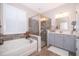 Spa-like bathroom with a soaking tub and walk-in shower at 2518 Fontaine Dr, Kissimmee, FL 34741