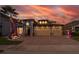 Two-story house with three-car garage, illuminated at night at 2518 Fontaine Dr, Kissimmee, FL 34741