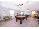 Spacious game room with pool table and seating at 2518 Fontaine Dr, Kissimmee, FL 34741