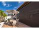 Outdoor patio with table, chairs, and retractable awning at 2518 Fontaine Dr, Kissimmee, FL 34741