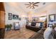Spacious living room featuring a leather sectional sofa and high ceilings at 2518 Fontaine Dr, Kissimmee, FL 34741