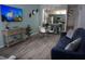 Open concept living and dining area with large TV at 4001 Santa Maria Dr # 103, Kissimmee, FL 34741