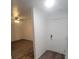 Bright entryway with wood-look flooring and white door at 414 Banana Cay Dr # I, South Daytona, FL 32119