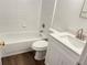 Clean bathroom with a white vanity, bathtub, and toilet at 414 Banana Cay Dr # I, South Daytona, FL 32119