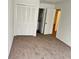 Bright bedroom featuring a sizable closet and access to a bathroom at 414 Banana Cay Dr # I, South Daytona, FL 32119