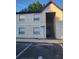 Exterior view of a two-story building with stairs and parking in front at 414 Banana Cay Dr # I, South Daytona, FL 32119