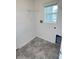 Laundry room with tile flooring and shelving at 414 Banana Cay Dr # I, South Daytona, FL 32119