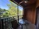 Screened lanai with table and chairs overlooking a lake at 12539 Floridays Resort Dr # 104 D, Orlando, FL 32821