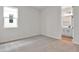 Well-lit bedroom with carpet and access to bathroom at 154 Bull Frog Ln, Umatilla, FL 32784
