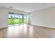 Gathering room with tile floors and sliding glass doors to backyard at 154 Bull Frog Ln, Umatilla, FL 32784
