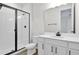 Updated bathroom with white vanity, toilet and shower at 154 Bull Frog Ln, Umatilla, FL 32784