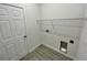 Laundry room with built-in shelving and utility hookups at 274 Elm Ct, Kissimmee, FL 34759