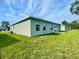 Single-Gathering home with green exterior and grassy lawn at 274 Elm Ct, Kissimmee, FL 34759