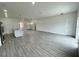 Open concept living area with wood-look tile flooring and lots of natural light at 274 Elm Ct, Kissimmee, FL 34759