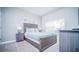 Bright bedroom with a queen-size bed and ample closet space at 8919 Stinger Dr, Davenport, FL 33896