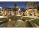 Elegant fountain in the community's courtyard at night at 8919 Stinger Dr, Davenport, FL 33896