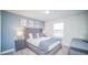 Primary bedroom with plush bed and gray accents at 8919 Stinger Dr, Davenport, FL 33896