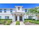 Front view of two-story townhome with landscaping at 8919 Stinger Dr, Davenport, FL 33896