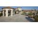 Community clubhouse with a fountain and outdoor seating areas at 8919 Stinger Dr, Davenport, FL 33896