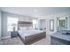 Main bedroom with king-size bed and ensuite bathroom at 8919 Stinger Dr, Davenport, FL 33896